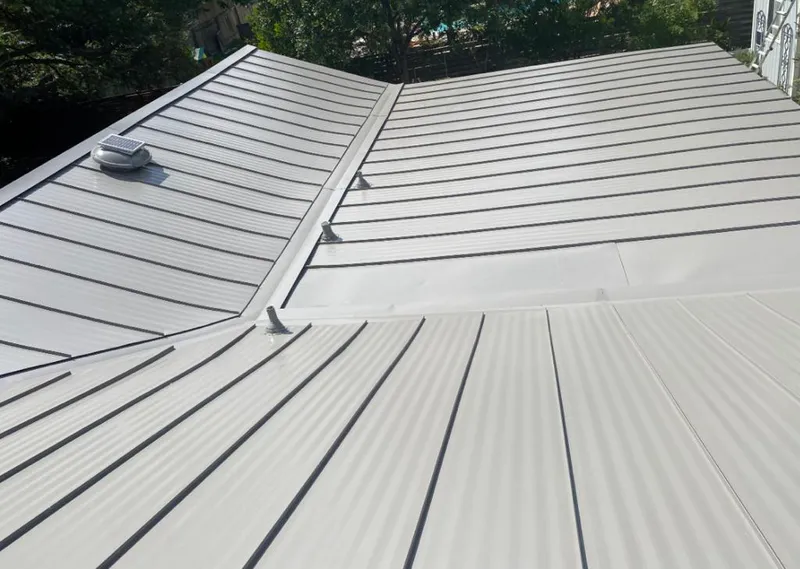 Solar attic fan installed on a metal roof for Roof Ventilation in Lindon